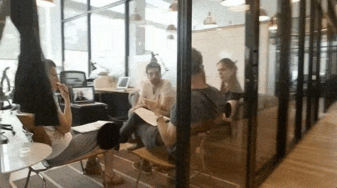 People sitting around brainstorming testimonial video ideas