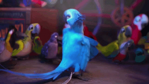 a scene from Rio of Jewel dancing with a whole bunch of other parrots dancing around her and watching her