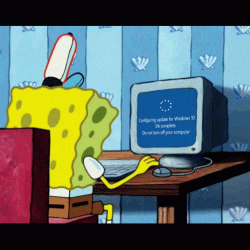 Sponge Bob sitting at his computer dead still waiting for a Windows update