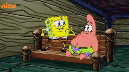 Sponge Bob Square Pants and Patrick giving each other a high five on a bench and looking very happy