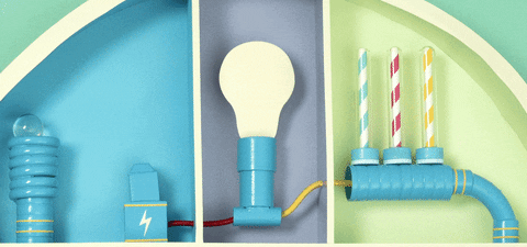a ball pops out of a spring and lands on a battery which turns the light bulb on and makes the blue red and yellow cylinders spin