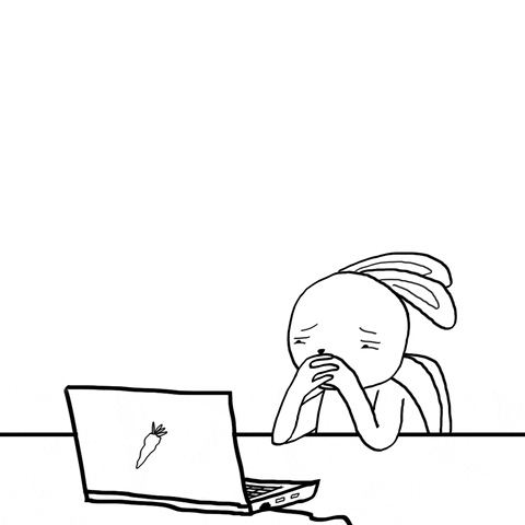 a rabbit like character sitting at its desk with its hands on its mouth looking tired and staring at its computer which has a carrot on the cover