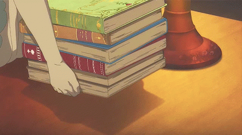 a human character putting a big pile of multi color stop motion books on a desk
