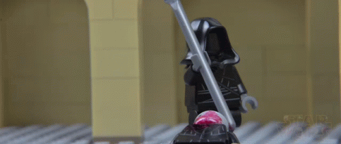 star wars lego character animated in stop motion style turning a weapon around and getting struck by electricity and falling over