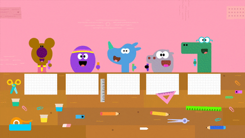 many animal characters drawing shapes on paper with stationary all over the desk