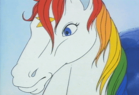 a white unicorn with rainbow colored main and blue eyes talking