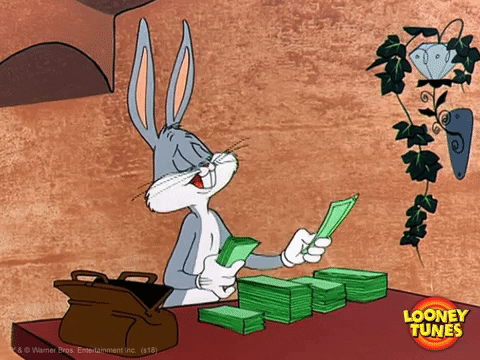 Bugs Bunny counting his money on a table and licking his fingers and counting it into different piles 