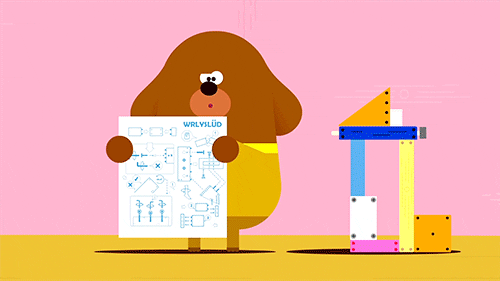 a dog like character reading instructions and he's building a structure and when he screws something in it falls over and he looks disappointed 